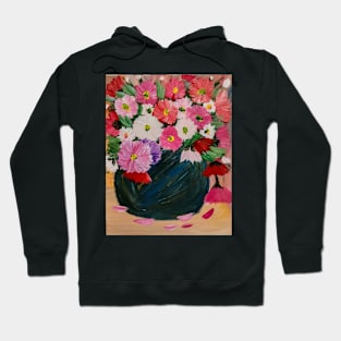 A lovely boutique of flowers in a blue vase . Hoodie